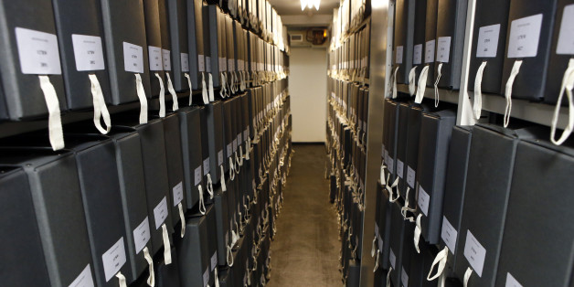 Archive boxes in one of the many temperature-controlled storage rooms where historic archived documents are stored on shelves at the City of Paris archive center during a presentation to the press in Paris, France, Tuesday, Dec.15, 2015. The city of Paris has decided to collect and archive the notes and drawings left by passers-by on informal memorials on the sites of the Nov. 13 attacks, to keep the memory of the moving and spontaneous show of solidarity toward the victims. (AP Photo/Francois Mori)