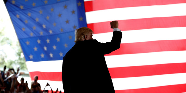 Republican U.S. presidential nominee Donald Trump reacts to cheers as he takes the stage at a campaign rally in Ocala, Florida, U.S., October 12, 2016. REUTERS/Mike Segar