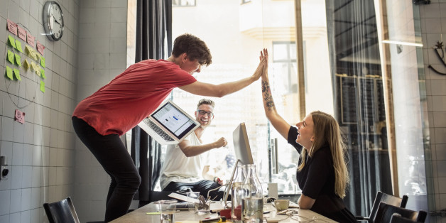Successful team of new business people in creative office