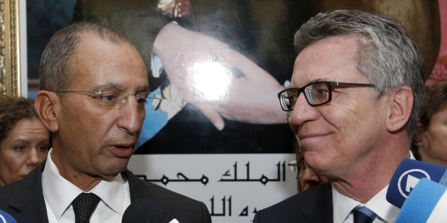 Moroccan Interior Minister, Mohamed Hassad, and his German counterpart, Thomas de Maiziere, right, speak to the media after their meeting at the interior ministry in Rabat, Morocco, Monday, Feb. 29, 2016. Maiziere is in Morocco as part of a North African trip that also will take him to Algeria and Tunisia on Monday and Tuesday. This trip is likely to be largely about persuading those countries to be more cooperative in taking rejected asylum seekers back. (AP Photo/Abdeljalil Bounhar)