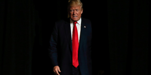 Republican U.S. presidential nominee Donald Trump walks on stage at a campaign rally in West Palm Beach, Florida, U.S., October 13, 2016. REUTERS/Mike Segar