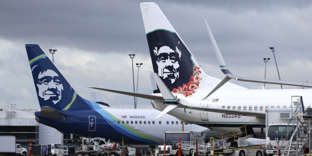 FILE - In this Monday, April 4, 2016, file photo, Alaska Airlines planes with the company's new livery and tail logo, left, and the old livery used to promote service to Hawaii, right, are shown parked at Seattle-Tacoma International Airport in Seattle. Alaska Airlines and JetBlue Airways still rank highest in the annual J.D. Power survey of passengers on the nine largest North American airlines, and the firm says overall traveler satisfaction with the industry is at a 10-year high. J.D. Power s
