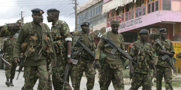 Kenyan Army soldiers patrol the centre of the town of Naivasha January 27, 2008. At least 10 people were killed in ethnic fighting in Naivasha on Sunday as rival tribal gangs set fire to homes and blocked roads. REUTERS/Peter Andrews (KENYA)