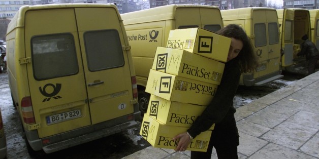 A Romanian woman carries boxes with childrens' toys December 18, 2001
donated as Christmas presents by German fans of the popular television
show "Wetten dass..." (You bet...). Meeting both of the challenges set
by the programme, German children donated 50,000 toys for Romanians in
a single day and the German post office delivered the shipment within
24 hours. REUTERS/Radu Sigheti REUTERS
RS/