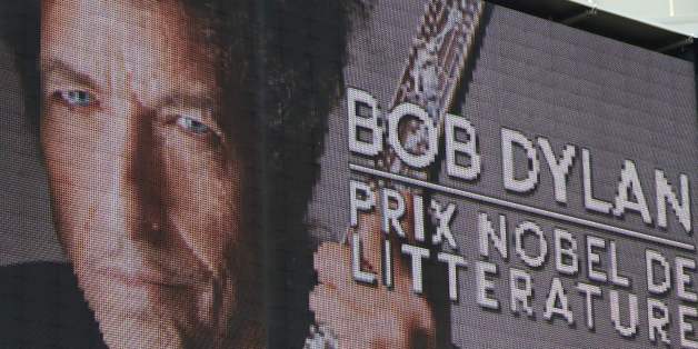 A board displays a picture of US musician Bob Dylan with the inscription 'Bob Dylan, Nobel Prize in Literature' before the European Champions Cup rugby union match between Toulon and Saracens at the Mayol stadium in Toulon on October 15, 2016. / AFP / BORIS HORVAT (Photo credit should read BORIS HORVAT/AFP/Getty Images)