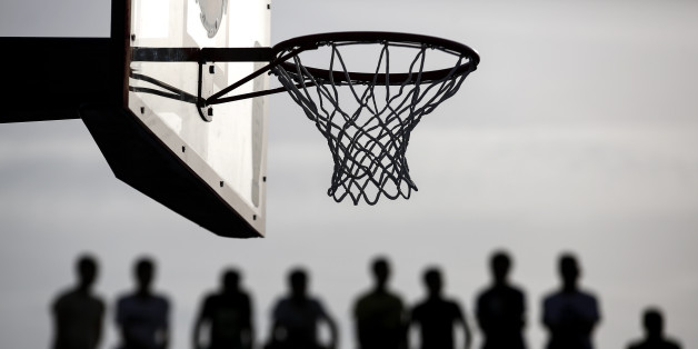 Spectators watch a friendly basketball game in Athens, on Sunday, May 29, 2016. Latvian New York Knicks star Kristaps Porzingis joined fellow NBA player Giannis Antetokounmpo, of the Milwaukee Bucks, and his older brother Thanasis, for a game of streetball Sunday. The "Antetokounbros Streetball Event," organized by Eurohoops and the City of Athens, took place in an open court, at Greece's largest high school, and attended by 5,000 people. (AP Photo/Yorgos Karahalis)