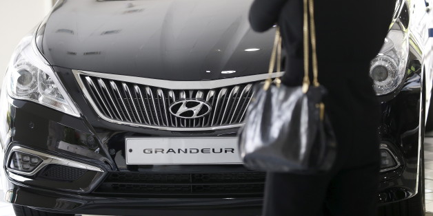 A visitor looks at a Hyundai Motor's Grandeur sedan at its dealership in Seoul, South Korea, April 25, 2016. REUTERS/Kim Hong-Ji