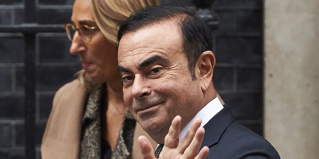 Nissan CEO Carlos Ghosn (R) waves as he leaves No 10 Downing Street in central London on October 14, 2016, after meeting with British Prime Minister Theresa May.Earlier this month, Ghosn said that Nissan was delaying new investment at its giant plant in Sunderland, northeast England, announcing: 'We cannot stay if the conditions do not justify that we stay.' / AFP / NIKLAS HALLE'N (Photo credit should read NIKLAS HALLE'N/AFP/Getty Images)