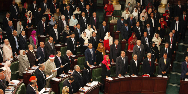 Members of the Tunisian parliament take oath in Tunis December 2, 2014. Tunisia's first full elected parliament held its opening session on Tuesday with a challenge to implement the democracy its people sought when they marched in the 2011 revolt against autocrat Zine el-Abidine Ben Ali. REUTERS/Zoubeir Souissi (TUNISIA - Tags: ELECTIONS POLITICS)