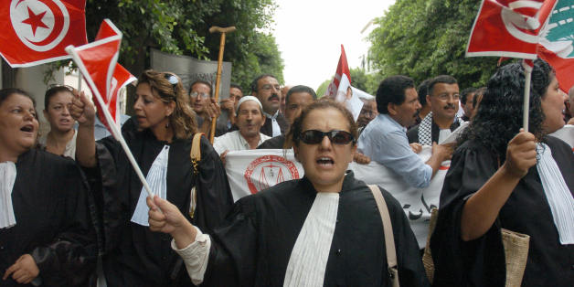 Tunis, TUNISIA: Tunisian Lawyers shout during a protest against the Israeli offensive in Lebanon 09 August 2006 in Tunis. Tunisian President Ben Ali strongly denounced the Israeli attacks in Lebanon where at least 1,087 people, mostly civilians, have been killed since 12 July, according to an AFP count of official tolls today. AFP PHOTO/FETHI BELAID (Photo credit should read FETHI BELAID/AFP/Getty Images)