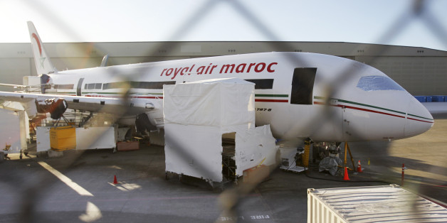 A 787 Dreamliner jet painted in Royal Air Maroc livery, sits idle on the tarmac parking at Paine Field in Everett, Washington, January 17, 2013. Airlines scrambled to rearrange flights as Europe, Japan, Qatar and India joined the United States in grounding Boeing Co's 787 Dreamliner passenger jets while battery-related problems are investigated. REUTERS/Anthony Bolante (UNITED STATES - Tags: TRANSPORT BUSINESS)