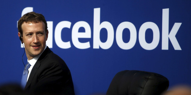 Facebook CEO Mark Zuckerberg is seen on stage during a town hall at Facebook's headquarters in Menlo Park, California September 27, 2015. Picture taken February 27, 2015. REUTERS/Stephen Lam/File Photo