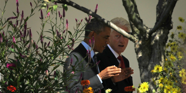 WASHINGTON, DC - SEPTEMBER 12: U. S. President Barack Obama (L) walks with former U.S. President Bill Clinton (R) prior to an AmeriCorps Pledge ceremony on the South Lawn of the White House September 12, 2014 in Washington, DC. President Clinton, who established the program and swore in the first class in 1994, joined President Obama to celebrate the 20th anniversary of the national service program. (Photo by Alex Wong/Getty Images)
