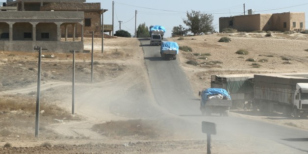 ALEPPO, SYRIA - OCTOBER 19: The Humanitarian Aid Foundation's vehicles arrive at new village which was established near Sajur River by the Syrian civilians escaping from Um A'amuda village of Al-Safirah district located in south of Aleppo, Syria due to the Assad regime's attacks in 2012, in northern Aleppo, Syria on October 19, 2016.
(Photo by Mustafa Sultan/Anadolu Agency/Getty Images)