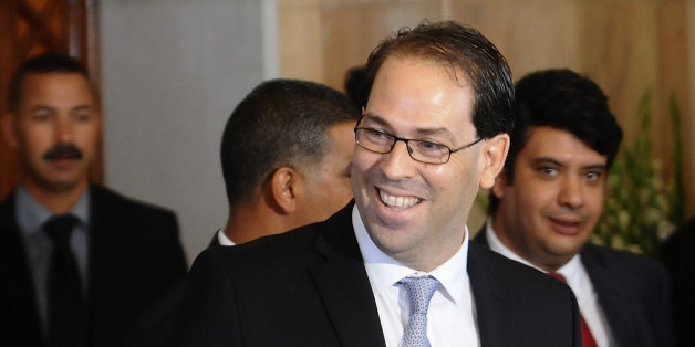 Tunisia's new Prime Minister Youssef Chahed smiles before a press conference at the presidential palace in Tunis, Wednesday, Aug.3, 2016. Chahed served as minister for local affairs in the government that fell over the weekend in a no-confidence vote. The choice of Chahed is controversial in some minds because he is related by marriage to President Beji Caid Essebsi, who nominates the new prime minister. (AP Photo/Hassene Dridi)