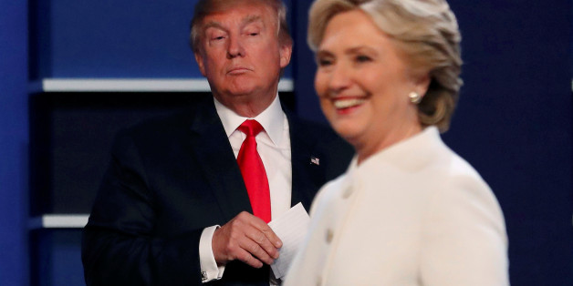 Republican U.S. presidential nominee Donald Trump and Democratic U.S. presidential nominee Hillary Clinton finish their third and final 2016 presidential campaign debate at UNLV in Las Vegas, Nevada, U.S., October 19, 2016. REUTERS/Mike Blake TPX IMAGES OF THE DAY