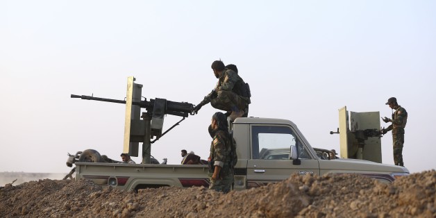 MOSUL, IRAQ - OCTOBER 23: Iraqi Kurdish Regional Government's peshmerga forces take positions as they attack Daesh targets to capture Nawaran Village and the other surrounding villages from Daesh terrorists during the operation to retake Iraq's Mosul from Daesh terrorists, in Mosul, Iraq on October 23, 2016. A much anticipated Mosul offensive to liberate the city from Daesh began midnight of 16th of October. (Photo by Emrah Yorulmaz/Anadolu Agency/Getty Images)