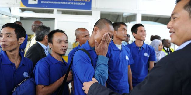 Hostage of Somali pirates react as they arrive at the Jomo Kenyatta International Airport in Nairobi on October 23, 2016 after being freed with other hostages.
Somali pirates have freed 26 Asian hostages held for nearly five years after the hijacking of their fishing vessel, the last commercial ship seized at the height of the country's piracy scourge, negotiators said on October 22, 2016. The crew of the Naham 3, the second longest held hostage by Somali pirates, were taken captive when their Omani-flagged vessel was seized in March 2012 south of the Seychelles.
/ AFP / STRINGER (Photo credit should read STRINGER/AFP/Getty Images)