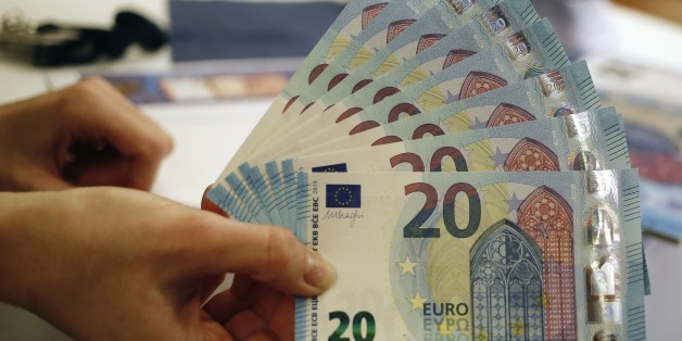 New 20 Euro banknotes are presented at the Austrian national bank in Vienna February 24, 2015. The banknote features new security characteristics and will be issued on November 15, 2015. The ECB unveiled the new 20 Euro bank note on Tuesday, which it said would help it stay ahead of counterfeiters. REUTERS/Leonhard Foeger (AUSTRIA - Tags: BUSINESS)
