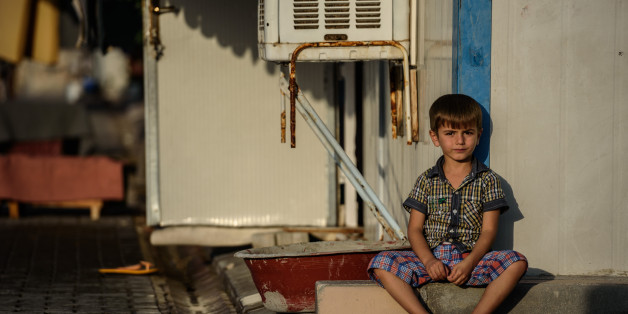 A Syrian child sits at a refugee camp in the Kilis district of Gaziantep, southeastern Turkey, on October 23, 2016.
France's foreign minister urged the international community to 'do everything' to end the 'massacre' in the Syrian city of Aleppo after fighting resumed following a 72-hour truce declared by Damascus ally Russia. / AFP / OZAN KOSE (Photo credit should read OZAN KOSE/AFP/Getty Images)
