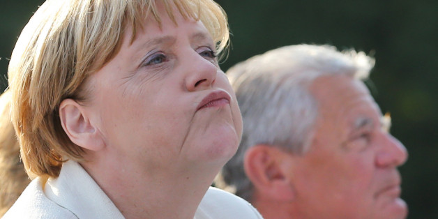 German Chancellor Angela Merkel (L) and German President Joachim Gauck attend an event for citizens at Bellevue Palace in Berlin on September 9, 2016. / AFP / dpa / Wolfgang Kumm / Germany OUT (Photo credit should read WOLFGANG KUMM/AFP/Getty Images)