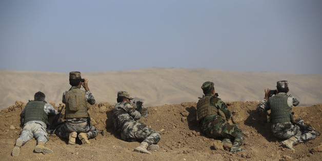 MOSUL, IRAQ - OCTOBER 23: Iraqi Kurdish Regional Government's peshmerga forces take positions as they attack Daesh targets to capture Nawaran Village and the other surrounding villages from Daesh terrorists during the operation to retake Iraq's Mosul from Daesh terrorists, in Mosul, Iraq on October 23, 2016. A much anticipated Mosul offensive to liberate the city from Daesh began midnight of 16th of October. (Photo by Emrah Yorulmaz/Anadolu Agency/Getty Images)