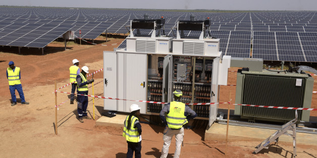 Technicians operate electrical cabinets on October 22, 2016 during the opening ceremony of a new photovoltaic energy production site in Bokhol.
Senegal put into service one of sub-Saharan Africa's largest solar energy projects Saturday as it pushes to become a regional player in renewables on a continent where the majority remain off-grid. / AFP / SEYLLOU (Photo credit should read SEYLLOU/AFP/Getty Images)