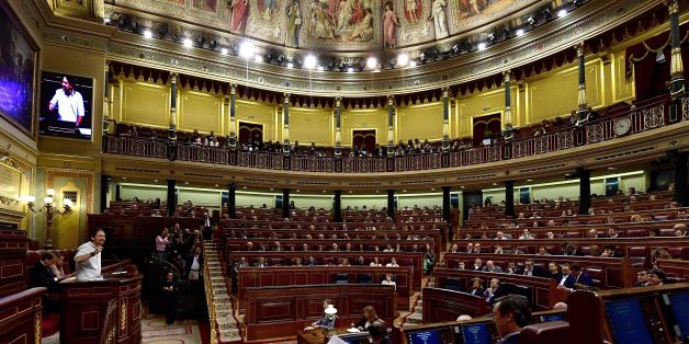 Leader of anti-austerity political party Podemos, Pablo Iglesias (L), speaks at the Spanish Congress (Las Cortes) on October 27, 2016, in Madrid during the second day of the parliamentary investiture debate to vote through a prime minister.
As the conservatives prepare to re-take power in Spain after 10 months of political limbo, anti-austerity party Podemos is bent firmly on replacing the divided Socialists as the main opposition force.
/ AFP / GERARD JULIEN (Photo credit should read GERARD JULIEN/AFP/Getty Images)