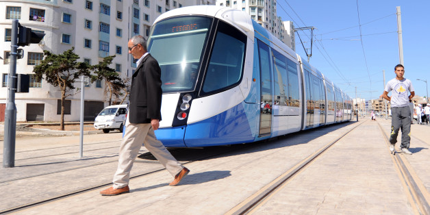 Men walk along the tracks of Algiers new tramway system which opened on May 8, 2011. After a two-year delay, the new tramway service opened, starting with a 7.2 km section running between Bordj El Kiffan and Bab-Ezzouar, serving residents in the densely populated eastern part of the city. AFP PHOTO / FAROUK BATICHE (Photo credit should read FAROUK BATICHE/AFP/Getty Images)