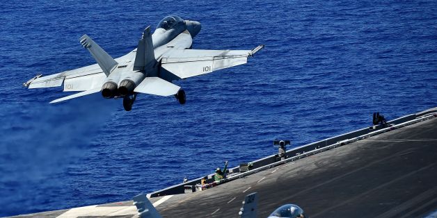 An F/A-18F Super Hornet takes off from the US navy's super carrier USS Dwight D. Eisenhower (CVN-69) ('Ike') in the Mediterranean Sea on July 7, 2016. The US aircraft carrier is deployed in support of Operation Inherent Resolve, maritime security operations and theater security cooperation efforts in the US 6th Fleet area of operations. Air Wings embarked aboard conducted strikes against the terrorist group ISIL in Libya, Iraq and Syria. / AFP / ALBERTO PIZZOLI (Photo credit should read