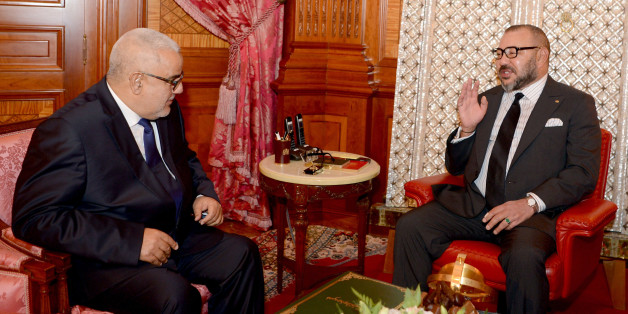 In this photo provided by the Royal Palace, Moroccan King Mohammed VI, right, chats with Moroccan head of the country's government Abdelilah Benkirane in Casablanca, Morocco, Monday, Oct. 10, 2016. Morocco's King Mohammed VI named leader of the Islamist Justice and Development Party, known as the PJD, Abdelilah Benkirane as prime minister for a second term after his party wining the most seats in last week's election. (AP Photo/Moroccan Royal Palace)
