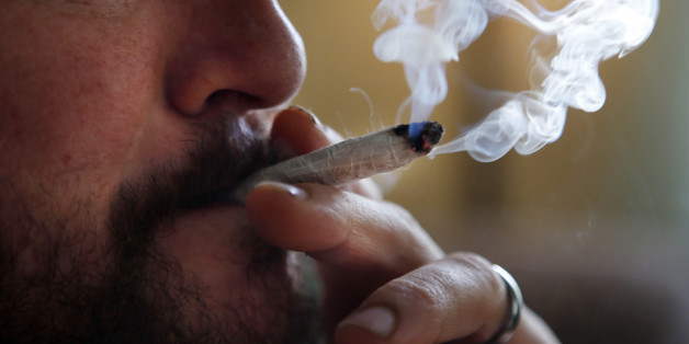 FILE-In this Nov. 21, 2014, file photo, a former U.S. Marine smokes medical marijuana in Belfast, Maine. A handful of recreational marijuana legalization drives has the medical pot industry bracing for something it never expected to deal with: competition. (AP Photo/Robert F. Bukaty, file)