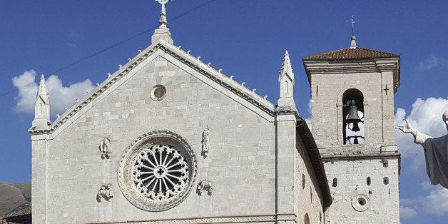 This photo taken on Aug. 21, 2016 shows the 14th century Cathedral of St. Benedict (San Benedetto) with its bell tower in the background, in Norcia, central Italy. Another powerful earthquake shook Central Italy on Sunday, Oct. 30, 2016, sending panicked residents running into piazzas, raining boulders onto highways and toppling the Benedictine cathedral and other historic edifices that had withstood several recent quakes. (AP Photo/Simona Polimeni)