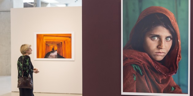 ANKARA, TURKEY - SEPTEMBER 15: Photographs taken by American photographer Steve McCurry, best known for his photo 'Afghan Girl', are displayed at CerModern in Ankara, Turkey on September 15, 2015. The exhibition will last from 16 September to 13 December 2015. (Photo by Mustafa Kamaci/Anadolu Agency/Getty Images)
