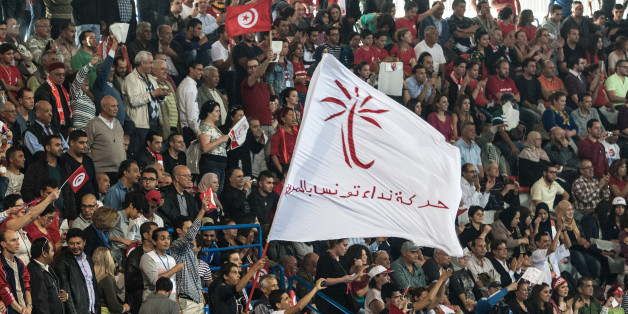 In this photo taken Saturday, Nov. 15, 2014, thousands of supporters of the Nidaa Tounes party led by Beji Caid Essebsi attend an electoral meeting in Tunis, Tunisia. The presidential campaign, featuring 25 competitors, kicked off in early November and it's the first time since Tunisians overthrew dictator Zine El Abidine Ben Ali in 2011 that they will choose their head of state through universal suffrage. If no candidate wins a majority Nov. 23, there will be a runoff between the top two vote-getters on Dec. 28. (AP Photo/Aimen Zine)