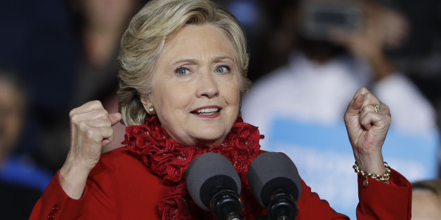 Democratic presidential candidate Hillary Clinton campaigns at the base of the John A. Roebling Suspension Bridge in Cincinnati, Monday, Oct. 31, 2016. (AP Photo/Matt Rourke)