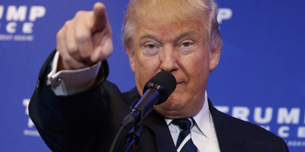 Republican presidential nominee Donald Trump points at the gathered media during his walk through at the Republican National Convention in Cleveland, U.S., July 21, 2016. REUTERS/Rick Wilking TPX IMAGES OF THE DAY