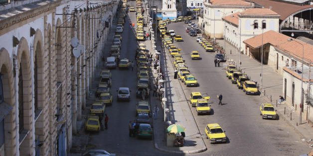 Algiers, ALGERIA: A picture taken 24 April 2006 shows taxis at a taxi stop near the port of Algiers. Algerians living in France use ships operating between Algiers and Marsielle. AFP PHOTO/FAYEZ NURELDINE (Photo credit should read FAYEZ NURELDINE/AFP/Getty Images)