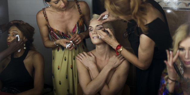 In this Sunday, Sept. 18, 2016 photo, Linni Rows Wiman, from Sweden, is made up by friends ahead of the Miss Trans Star International 2016 celebrated in Barcelona, Spain. Twenty-eight women representing as many countries competed last weekend to be crowned Miss Trans Star International, Europeâs largest beauty pageant for transgender women and one of a growing number of similar events aimed at celebrating a population more often condemned. (AP Photo/Emilio Morenatti)
