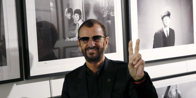 Musician Ringo Starr poses in front of some of his photographs during a media event as he launches his book "Photograph" at the National Portrait Gallery in London, Britain, September 9, 2015. REUTERS/Stefan Wermuth