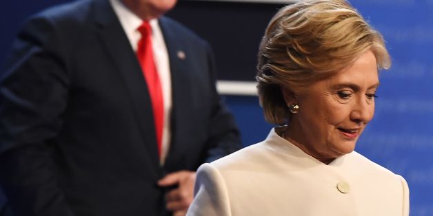 Democratic nominee Hillary Clinton (R) and Republican nominee Donald Trump walk off the stage after the final presidential debate at the Thomas & Mack Center on the campus of the University of Las Vegas in Las Vegas, Nevada on October 19, 2016. / AFP / Robyn Beck (Photo credit should read ROBYN BECK/AFP/Getty Images)
