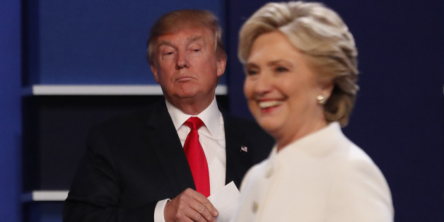 Republican U.S. presidential nominee Donald Trump and Democratic U.S. presidential nominee Hillary Clinton finish their third and final 2016 presidential campaign debate at UNLV in Las Vegas, Nevada, U.S., October 19, 2016. REUTERS/Mike Blake