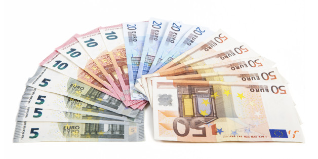 different euro bank notes fanned side by side, white background