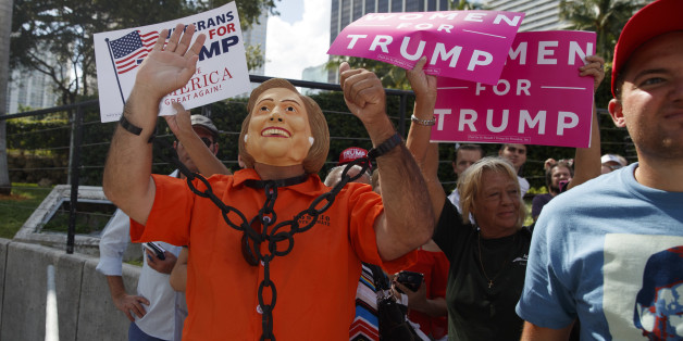 Supporters of Republican presidential candidate Donald Trump listen as he speaks during a campaign rally, Wednesday, Nov. 2, 2016, in Miami. (AP Photo/ Evan Vucci)