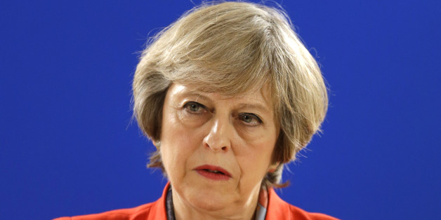 British Prime Minister Theresa May answers a question from the media during the final press briefing at the EU Summit in Brussels, Friday, Oct. 21, 2016. Prime Minister Theresa May signaled Friday that Britain is paving the way for trade talks with other countries well before it leaves the European Union but sought to reassure partners that this would not undermine the bloc's trade aims. (AP Photo/Alastair Grant)