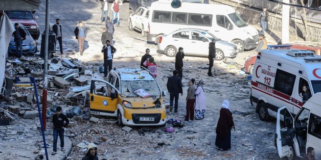 People gather near the explosion site on November 4, 2016 after a strong blast in the southeastern Turkish city of Diyarbakir.
Eight people were killed, including two police, and over 100 wounded in a car bombing by Kurdish militants in the southeastern Turkish city of Diyarbakir, Prime Minister Binali Yildirim said on November 4, 2016, updating an earlier toll. The blast, which Yildirim said was carried out by the outlawed Kurdistan Workers Party (PKK), targeted a police headquarters hours after top Kurdish politicians were detained in an unprecedented police crackdown.
/ AFP / ILYAS AKENGIN (Photo credit should read ILYAS AKENGIN/AFP/Getty Images)