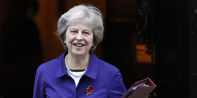 Britain's Prime Minister Theresa May leaves Downing Street to attend the weekly Prime Ministers' Questions session, in parliament in London, Wednesday, Nov. 2, 2016. Theresa May has condemned international soccer organization FIFA for its ban on players wearing the Britainâs remembrance poppy. She told Parliament on Wednesday that the FIFA decision was âutterly outrageous.â (AP Photo/Kirsty Wigglesworth)