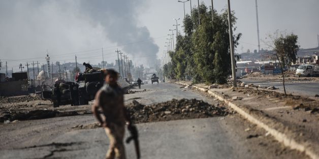 Iraqi forces wait in the town of Gogjali, on Mosul's eastern edge, as they head to the main hub city during a military operation to retake it from jihadists of the Islamic State group on November 4, 2016.Jihadist fighters unleashed a deluge of bombs and gunfire on Iraqi forces punching into the streets of Mosul for the first time, forcing some units into a partial pullback. / AFP / BULENT KILIC (Photo credit should read BULENT KILIC/AFP/Getty Images)