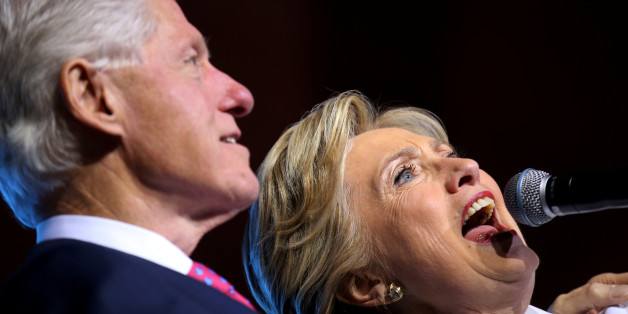 Democratic U.S. presidential candidate Hillary Clinton, acompanied by former president Bill Clinton, speaks at a campaign event after the third and final 2016 presidential campaign debate in North Las Vegas, Nevada, U.S., October 19, 2016. REUTERS/Carlos Barria