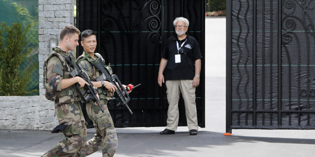French army soldiers pass by the hotel where the German national soccer team will stay during the Euro 2016 in Evian, France, Tuesday, June 7, 2016. Germany will face the Ukraine in a Euro 2016 Group C soccer match in Lille on Sunday, June, 12, 2016. (AP Photo/Michael Probst)